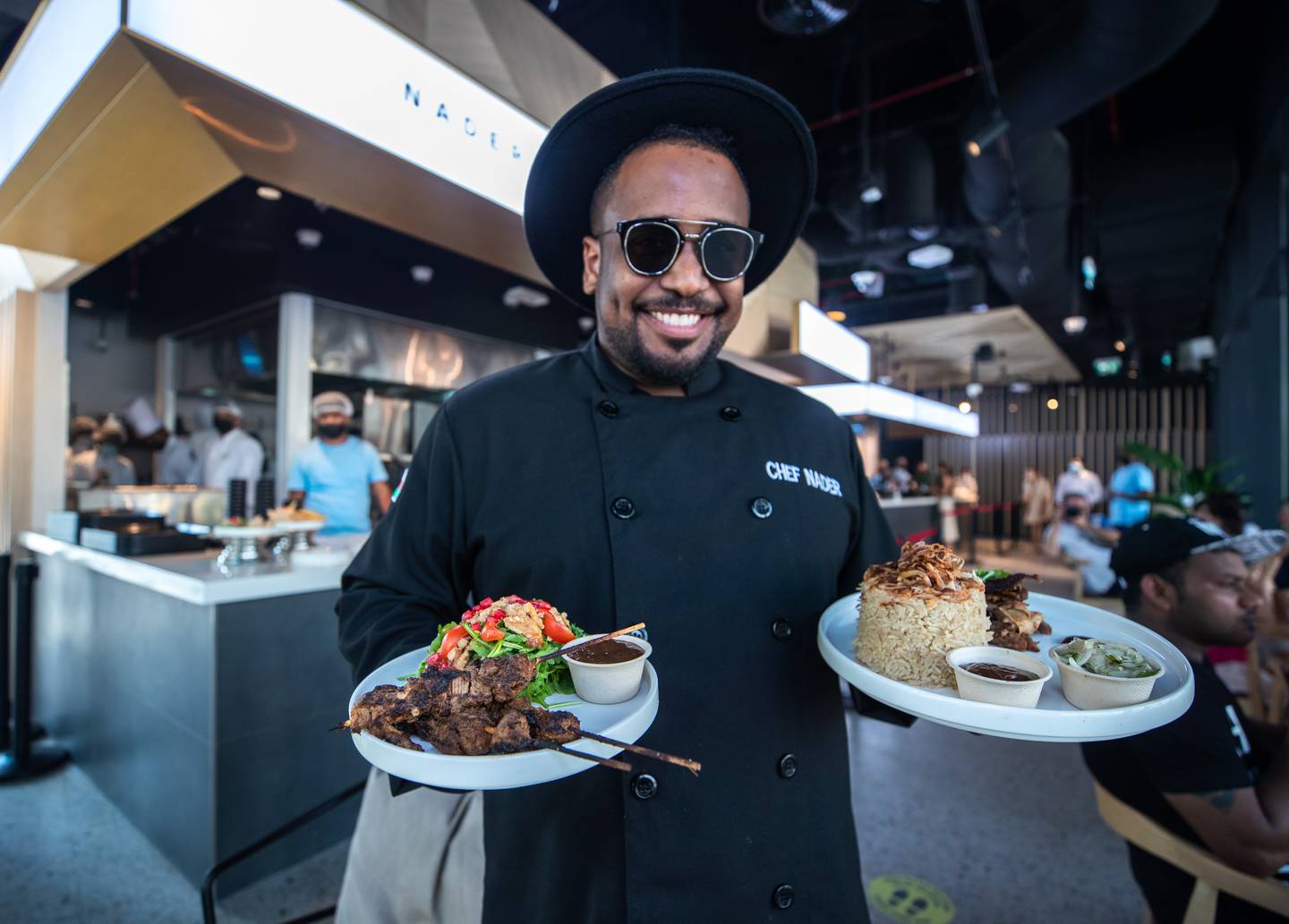 Nader Al Aisari with lamb shuwa by Chef Nader at the Rising Flavours pavilion in Jubilee Park Expo 2020 Dubai. Victor Besa / The National