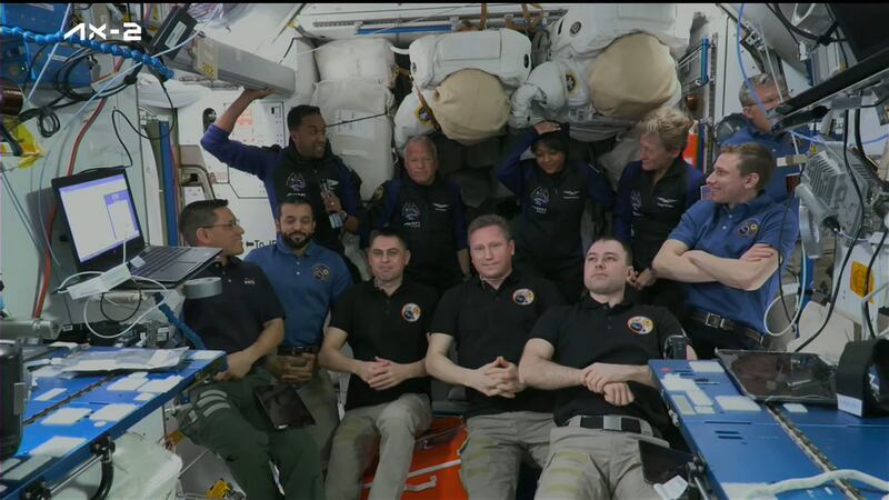 All 11 astronauts aboard the space station attend a welcoming ceremony for the Ax-2 crew members