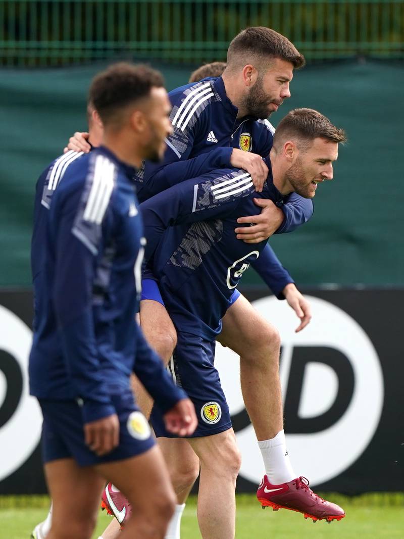 Scotland's Grant Hanley gets a piggy-back during training. PA