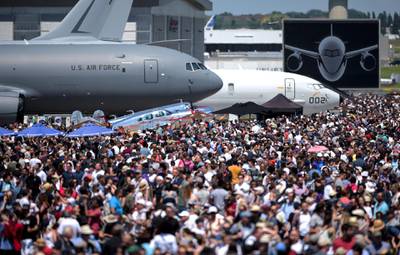 (FILES) In this file photo taken on June 22, 2019 visitors walk on the tarmac during the International Paris Air Show at Le Bourget Airport, near Paris. The 2021 edition of Paris Air Show is cancelled, organisers announced on December 7, 2020. / AFP / ERIC PIERMONT
