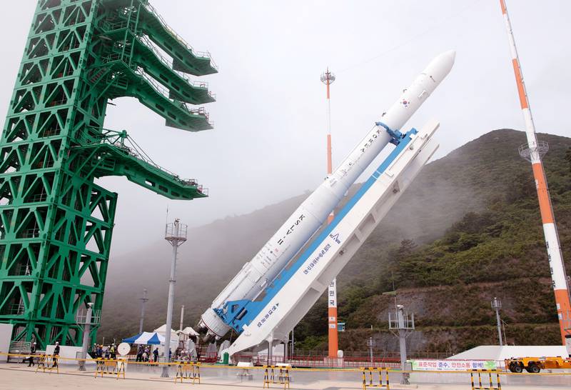 South Korea's second home-grown space rocket, called Nuri, is raised for launch at Naro Space Centre in Goheung. The event was rescheduled for Tuesday after aerospace engineers replaced a malfunctioning part. EPA