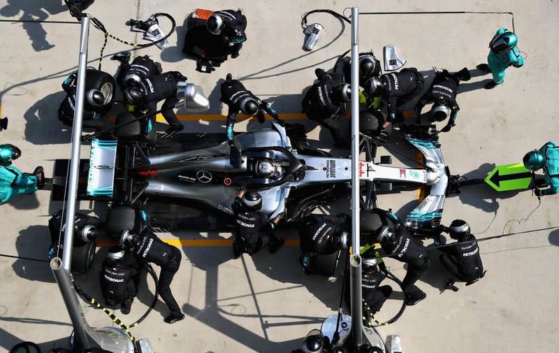 SHANGHAI, CHINA - APRIL 15: Lewis Hamilton of Great Britain driving the (44) Mercedes AMG Petronas F1 Team Mercedes WO9 makes a pit stop for new tyres during the Formula One Grand Prix of China at Shanghai International Circuit on April 15, 2018 in Shanghai, China.  (Photo by Mark Thompson/Getty Images)