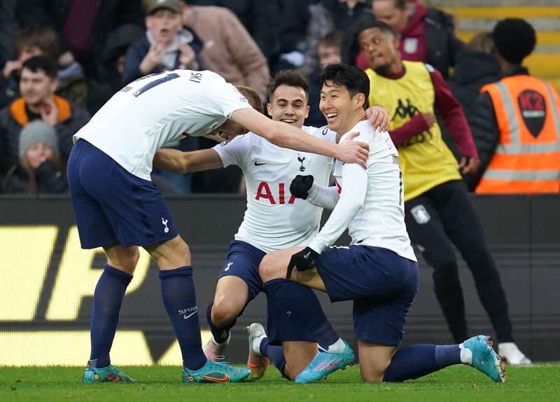 Son Heung-min (right) celebrates with team-mates after scoring the third goal. PA