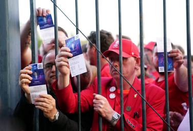 File photo dated 28-05-2022 of Liverpool fans stuck outside the ground showing their match tickets before the UEFA Champions League Final at the Stade de France, Paris. French interior minister Gerald Darmanin has apologised to "everyone who suffered from bad management" at the Champions League final in Paris. Issue date: Tuesday June 28, 2022.