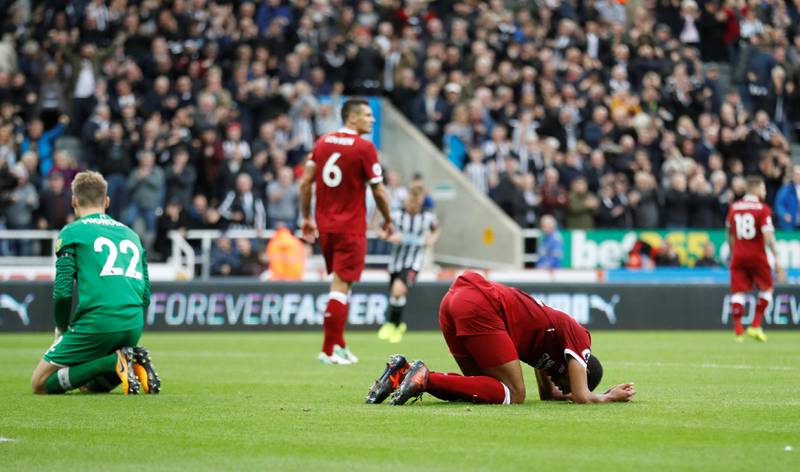 Soccer Football - Premier League - Newcastle United vs Liverpool - St James��� Park, Newcastle, Britain - October 1, 2017   Liverpool's Simon Mignolet and Joel Matip looks dejected after Newcastle United's Joselu scores their first goal    Action Images via Reuters/Carl Recine  EDITORIAL USE ONLY. No use with unauthorized audio, video, data, fixture lists, club/league logos or "live" services. Online in-match use limited to 75 images, no video emulation. No use in betting, games or single club/league/player publications. Please contact your account representative for further details.