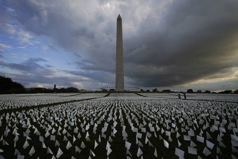 The memorial with the Washington Monument in the background. AP