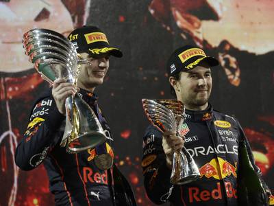 Red Bull's Max Verstappen celebrates with teammate Sergio Perez after winning the Abu Dhabi Grand Prix at Yas Marina Circuit on November 20, 2022. Reuters