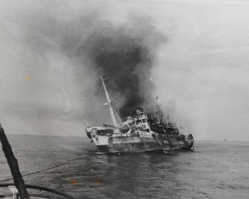 Listing heavily, the burnt out hulk of the SS Dara is shown under tow in this photographed produced at the UK Board of Trade Inquiry in the disaster in April 1961. UK National Archives