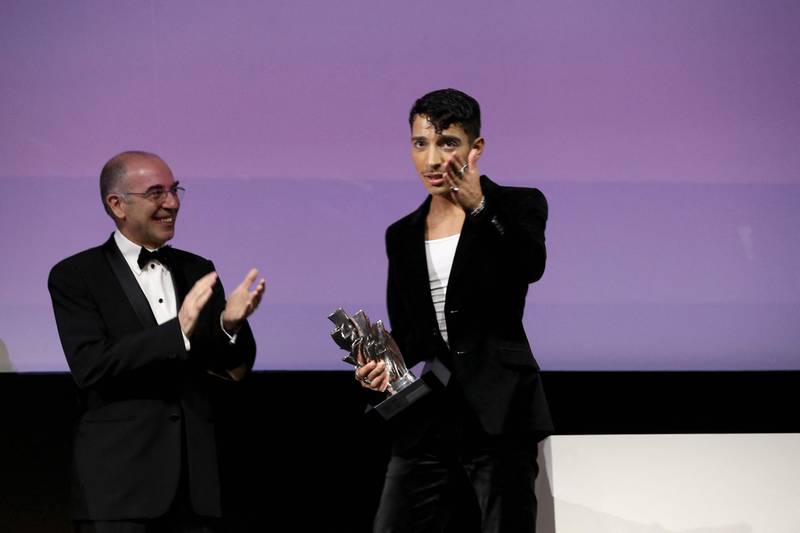 British-Libyan actor Adam Ali, right, receives his Best Actor award for his role in the film 'Europa'. Photo: Red Sea International Film Festival / AFP