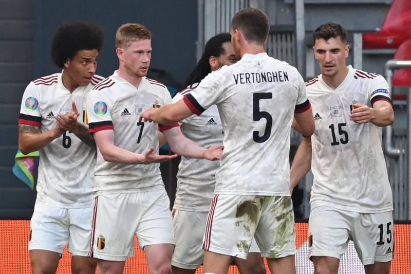 Belgium's midfielder Kevin De Bruyne celebrates with teammates after scoring the team's second goal at the Parken Stadium in Copenhagen. AFP