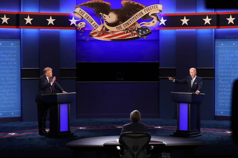 US President Donald Trump and Democratic presidential candidate Joe Biden participate with Moderator Chris Wallace in the first 2020 presidential election debate.  EPA