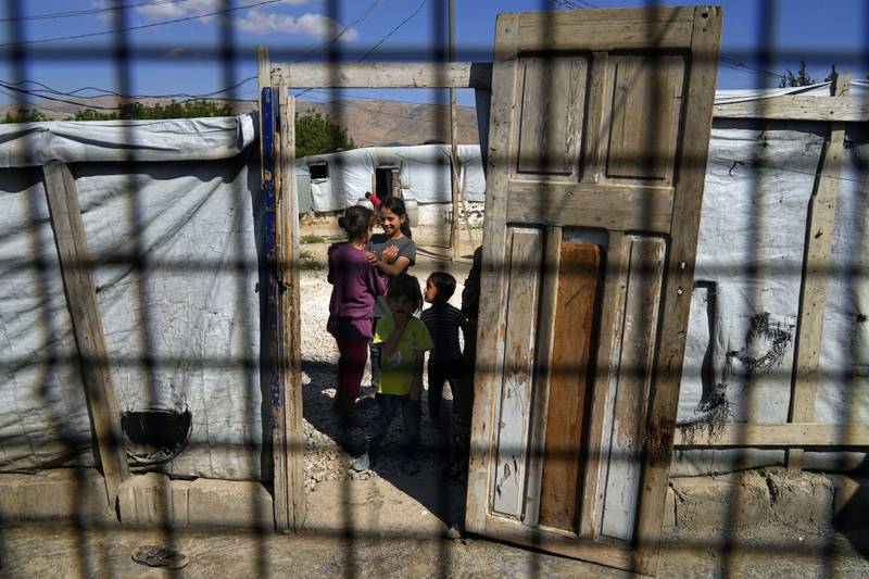 Syrian children at a refugee camp in the town of Bar Elias, in Lebanon's Bekaa Valley, in June. AP Photo