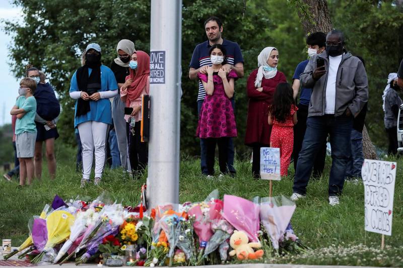 People gather at a makeshift memorial in London, Ontario, Canada, for four members of a Muslim family killed in what police say was a hit-and-run attack. Reuters