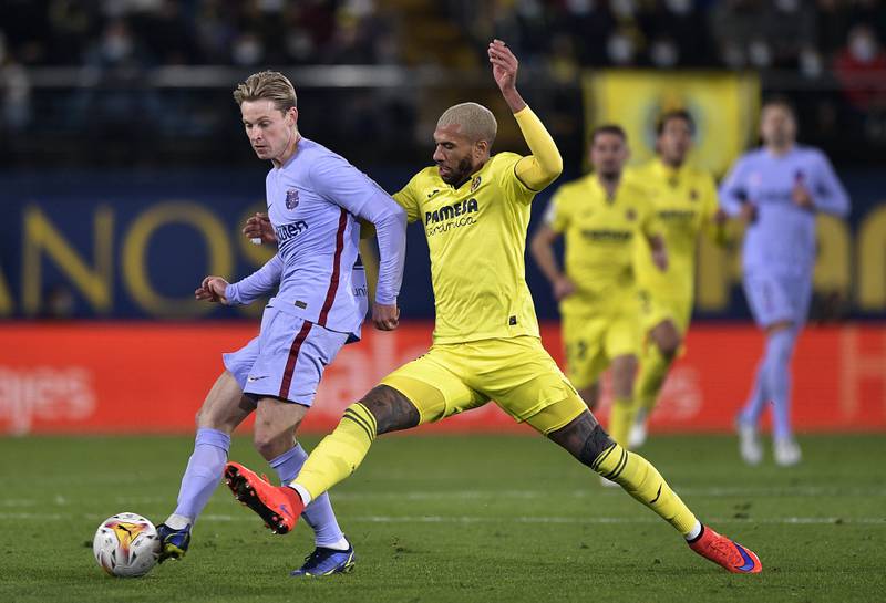 Villarreal's Etienne Capoue in action with Barcelona's Frenkie de Jong. AP Photo