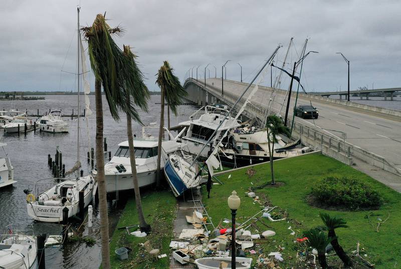 Boats are pushed up on to a causeway after Hurricane Ian hit Fort Myers. Getty Images