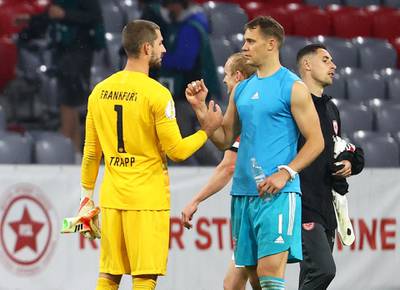 Eintracht Frankfurt's goalkeeper Kevin Trapp (L) shakes hands with Bayern Munich's goalkeeper Manuel Neuer after the match.  EPA