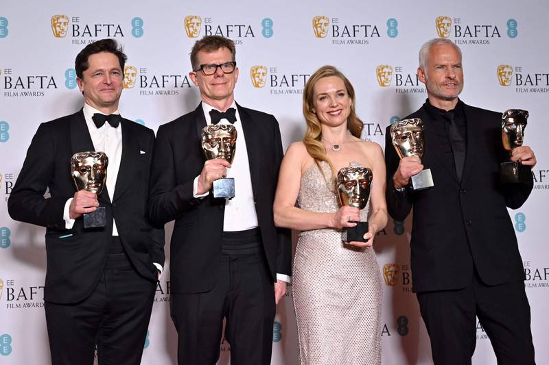 From left, British movie producers Pete Czernin and Graham Broadbent, Irish actress Kerry Condon and Irish screenwriter and director Martin McDonagh with their Baftas for The Banshees of Inisherin. AFP.