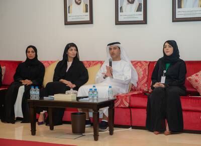 Hamad Al Dhaheri, undersecretary of Abu Dhabi's Department of Community Development, outlines the Family Wellbeing Strategy with Bushra Al Mulla, director-general of the FCA (second left). Wam