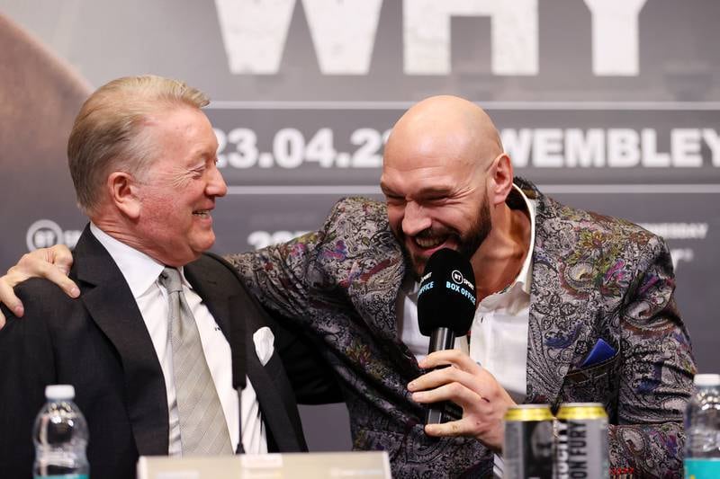 Tyson Fury and promoter Frank Warren enjoy a joke at Wembley. Getty