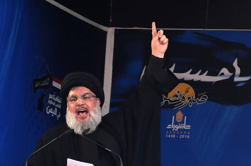 (FILES) In this file photo taken on October 12, 2016 Lebanon's Shiite movement Hezbollah's leader Hassan Nasrallah addresses a crowd during commemorations for Ashura in a southern Beirut suburb. - In a televised speech on August 14, on the occasion of the 12th anniversary marking the end of the July-August 2006 war between his movement and the Israeli army, Nasrallah said "Israel has the nerve to impose conditions regardless of its defeated in Syria". (Photo by PATRICK BAZ / AFP)