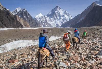 Tourists ride horses on the Godwin-Austen glacier between Concordia and K2 base camp in northern Pakistan.