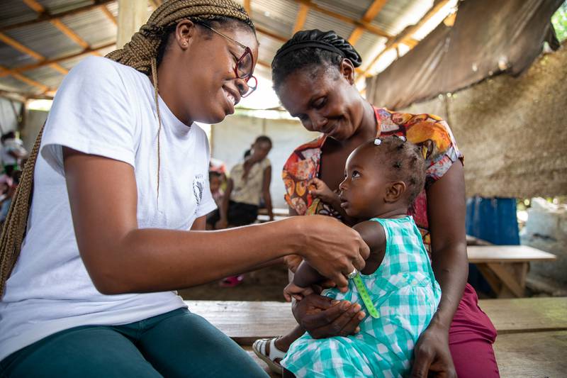 A mother and daughter pictured at a malnutrition screening in Haiti. Child malnutrition levels around the world are reaching a crisis point, according to Abigail Perry, director of nutrition at the World Food Programme.  All pictures: WFP