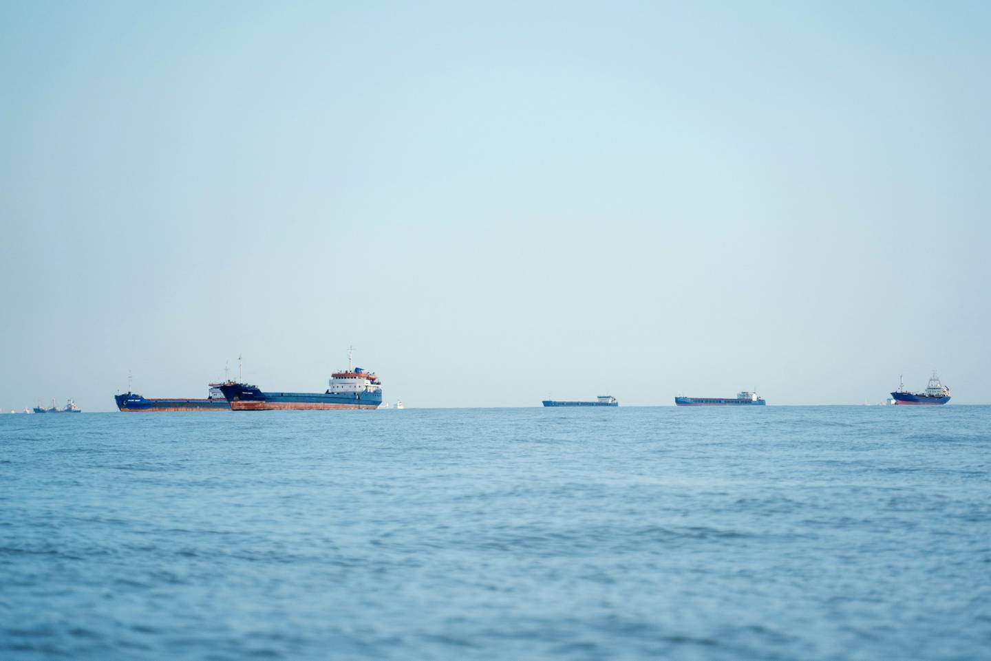 Cargo ships and bulk carriers in the Black Sea wait to enter Romania's Sulina Canal, a river channel that provides access to the Danube River. Bloomberg