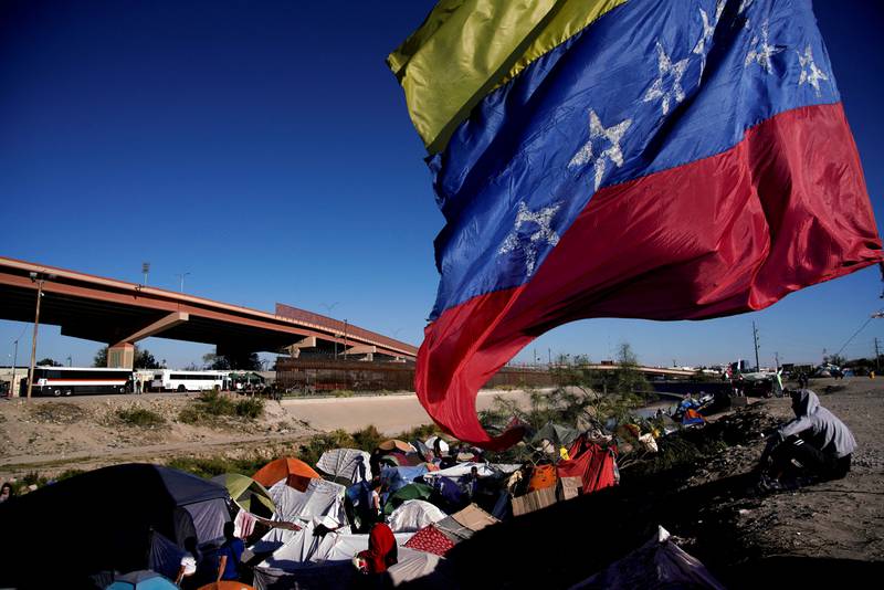 Venezuelan migrants who have been expelled from the US or are waiting for a change in immigration policy camp on the banks of the Rio Grande in Ciudad Juarez, Mexico. Reuters