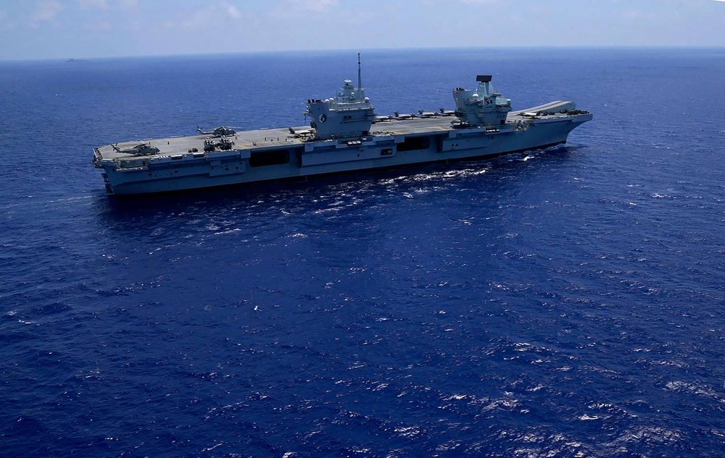 U.K.'s newest aircraft carrier HMS Queen Elizabeth in the Mediterranean Sea on Sunday, June 20, 2021. The British Royal Navy commanders say the U.K.'s newest aircraft carrier HMS Queen Elizabeth is helping to take on the "lion's share" of operations against the Islamic State group in Iraq as Russian warplanes get an up-close look at the cutting-edge F-35 jet in a "cat-and-mouse" game with British and U.S. pilots. (AP Photo/Petros Karadjias)