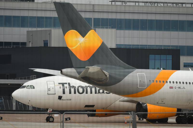 Thomas Cook Airline planes are pictured at the apron at Manchester Airport. AFP
