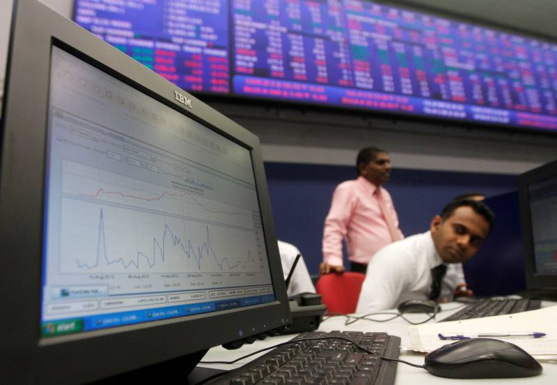 A broker monitors the stock market at the Colombo Stock Exchange. Photo: Reuters
