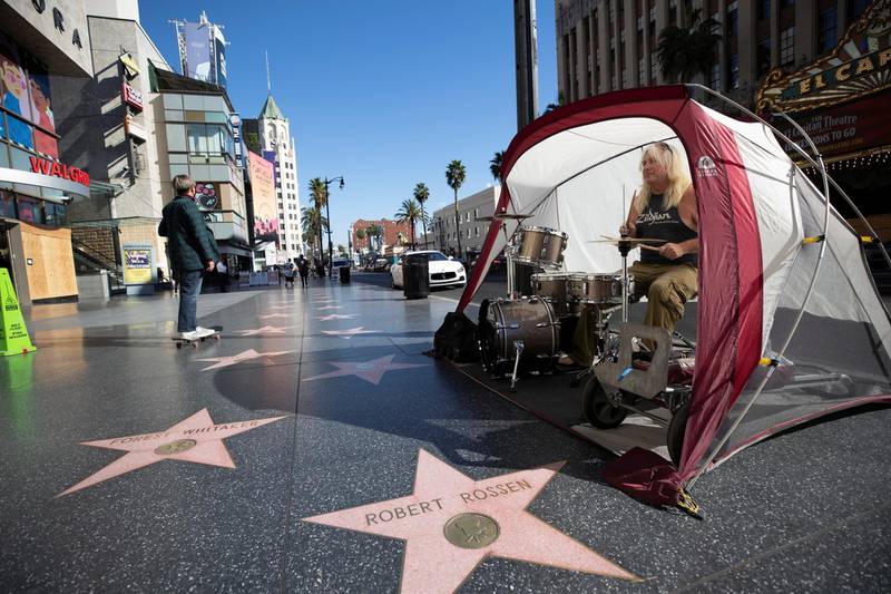 Patrick La May plays his drums in a tent on Hollywood Blvd in Los Angeles, California. Reuters