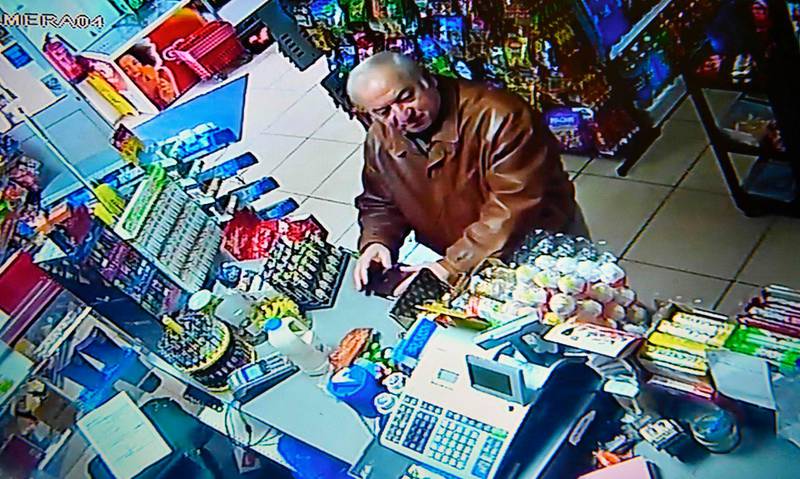 A still image from CCTV footage recorded on February 27, 2018 shows former Russian spy Sergei Skripal buying groceries at the Bargain Stop convenience store in Salisbury on February 27, 2018.
British detectives on March 8 scrambled to find the source of the nerve agent used in the "brazen and reckless" attempted murder of a Russian former double-agent and his daughter. Sergei Skripal, 66, who moved to Britain in a 2010 spy swap, is unconscious in a critical but stable condition in hospital along with his daughter Yulia after they collapsed on a bench outside a shopping centre on Sunday.
 / AFP PHOTO / -