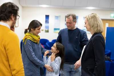 Nazanin Zaghari-Ratcliffe with her daughter Gabriella, husband Richard and British Foreign Secretary Liz Truss at RAF Brize Norton. EPA