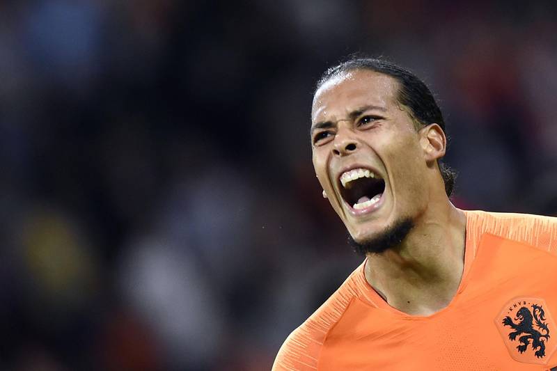 Netherlands' defender Virgil van Dijk celebrates after scoring the opening goal during the UEFA Nations League football match between Netherlands and Germany, on October 13, 2018 at Johan Crujiff ArenA in Amsterdam. / AFP / JOHN THYS         
