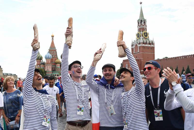 France supporters react in front of Saint Basil's Cathedral in Red Square in Moscow on June 26, 2018. Franck Fife / AFP