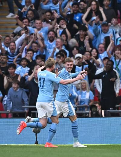 Manchester City's Cole Palmer celebrates scoring their first goal with Kevin De Bruyne. Reuters