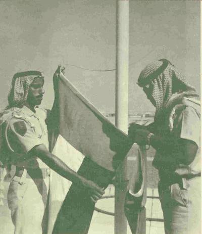 History Project 2010, "The First Day". The flag raising at Al Manhal Palace in Abu Dhabi. 2 December, 1971. Credit Ittihad Newspaper **EDS NOTE ***IMPORTANT** SEEK ADVISE FROM KAREN BEFORE USE*eds note this is a scan of Itihad newspaper, we need a better scan / copy photo** karen