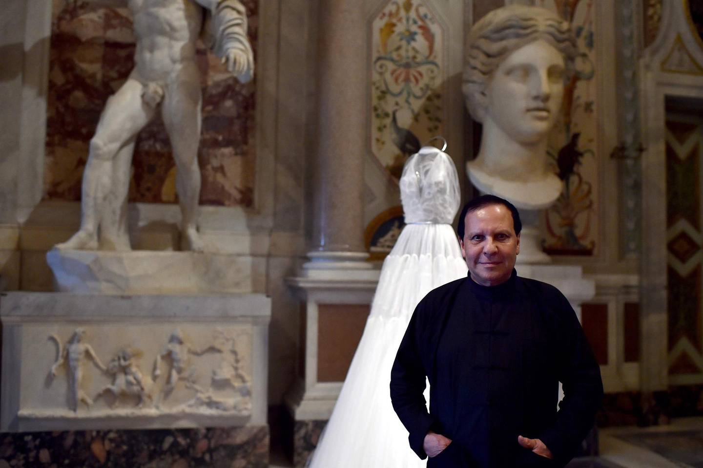 (FILES) This file photo taken on July 10, 2015 shows Tunisian-born, Paris-based couturier Azzedine Alaia posing during the press preview of the exhibition " Azzedine Alaia's soft sculpture" at the Galleria Borghese in Rome. 
Alaia died at age 77 according to the French Haute Couture Federation, AFP reports on November 18, 2017. / AFP PHOTO / Gabriel BOUYS