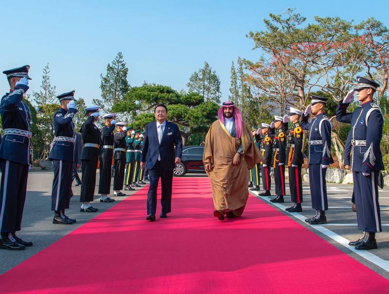 Crown Prince Mohammed walks on a rec carpet on his arrival in Seoul. Photo: Bandar Al-Jaloud