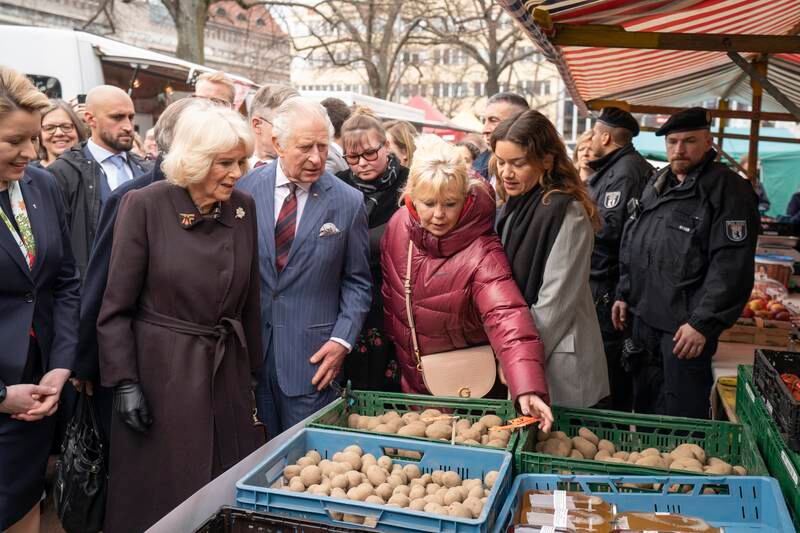 The royal couple visit a farmers' market in Berlin. EPA