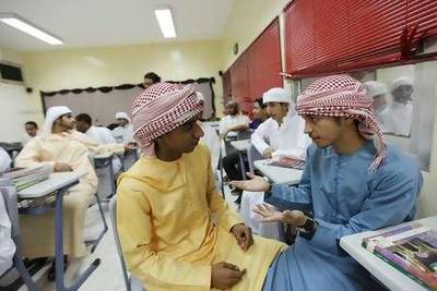 Mana Khalid, right, with a friend on the first day of classes at Mohammed bin Rashid Model School.