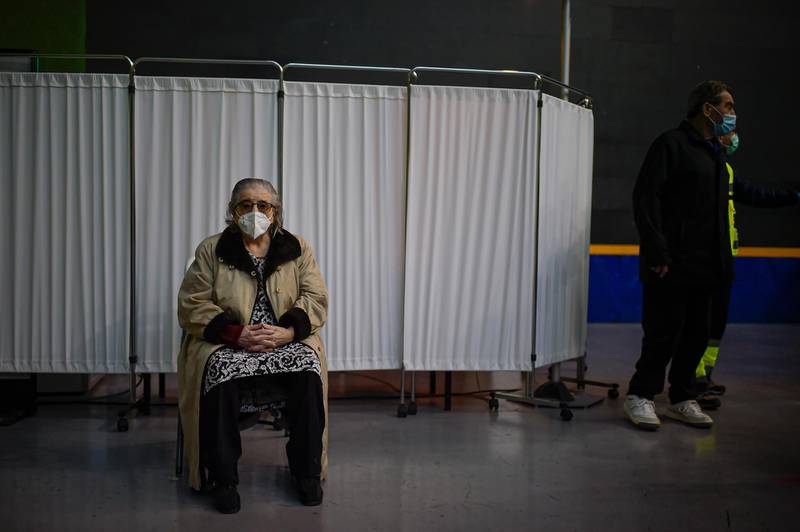 Teresa Cabello, 88, waits in a seat before receiving a Pfizer-BioNTech Covid-19 vaccine in Pamplona, northern Spain. AP Photo