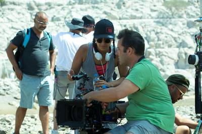 'Scales' director Shahad Ameen on set in Khasab, a small Omani town where the film was shot. Image Nation Abu Dhabi
