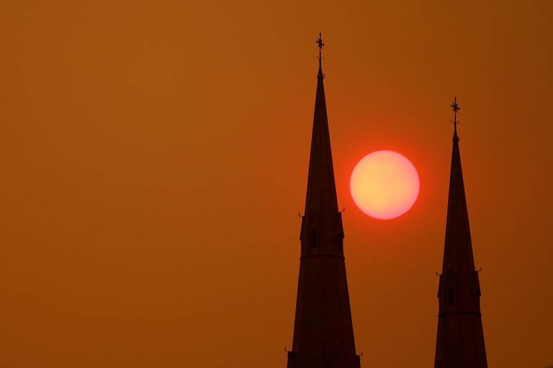 The sun sets behind St Mary's Cathedral in Sydney on December 6, 2019 in Sydney, Australia. Getty Images
