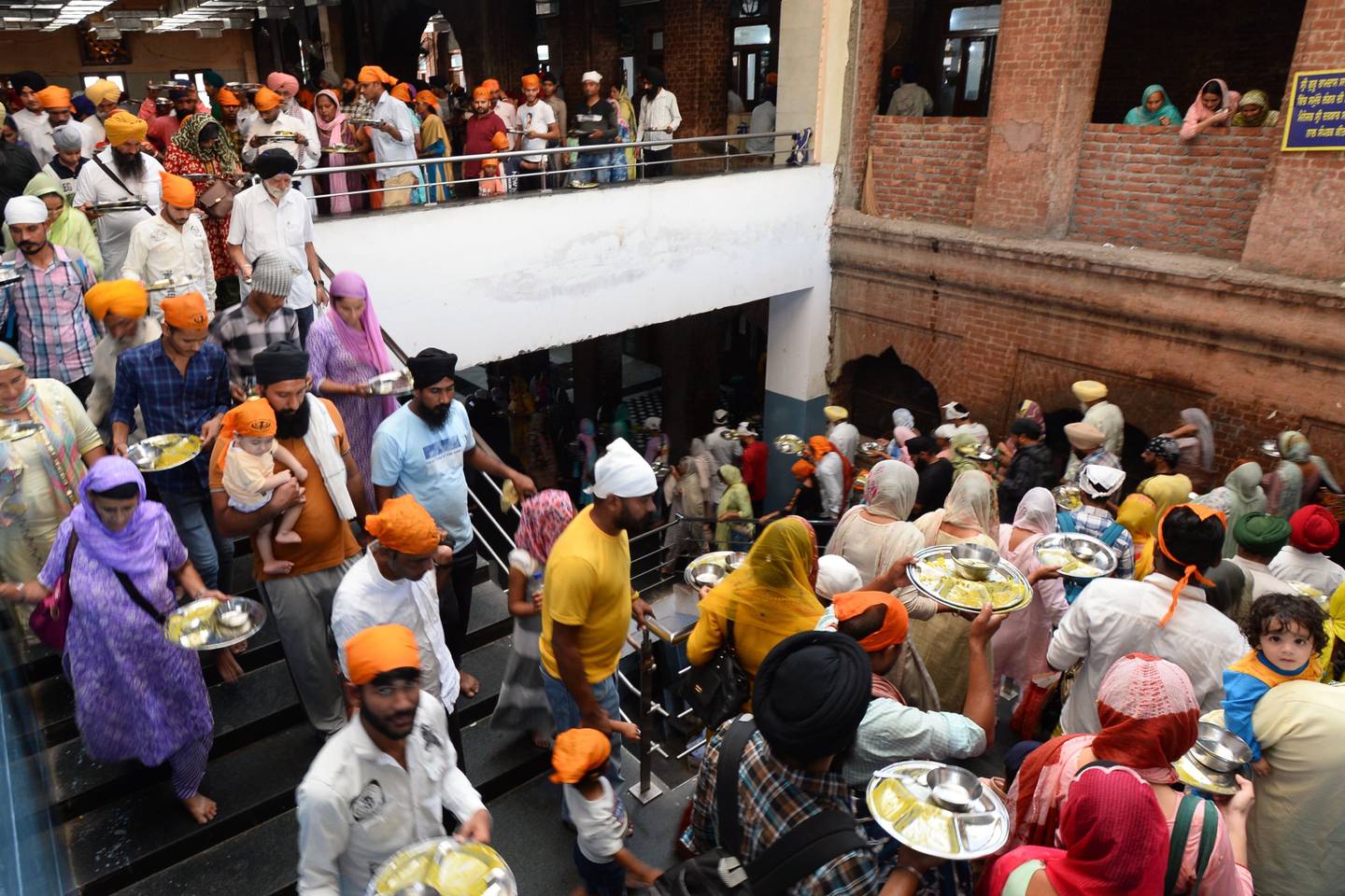 The world's largest free kitchen at Punjab's Golden Temple feeds 100,000 a day