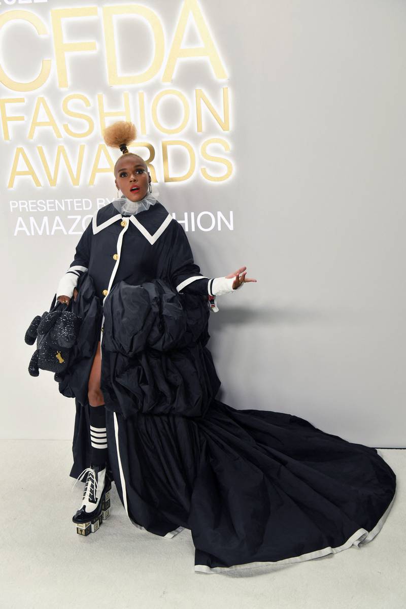 Janelle Monae wore an opera coat by Thom Browne, with building block heels and a bag shaped like a toy dog.