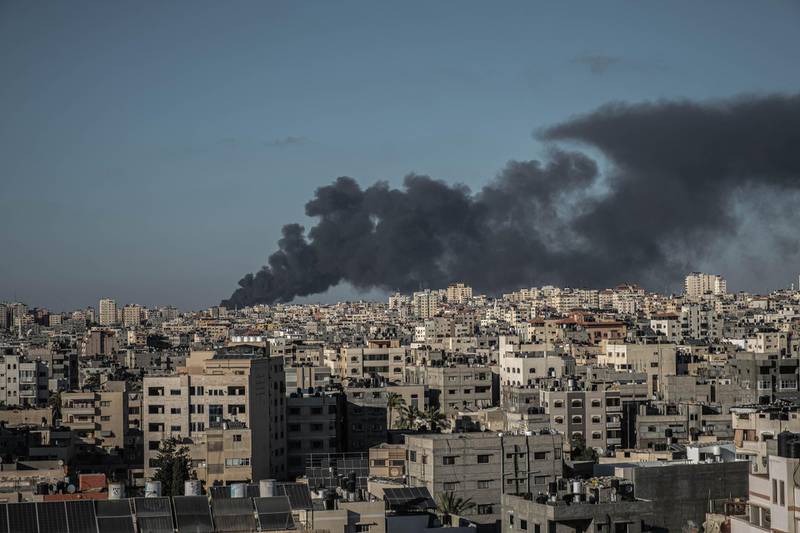 GAZA CITY, GAZA - MAY 15: A picture showing a local fire north of Gaza City, along with rockets fired from Gaza to Israel on May 15, 2021 in Gaza City, Gaza. More than 125 people in Gaza and eight people in Israel have been killed as cross-border rocket exchanges intensify bringing fears of war. Gaza residents have begun fleeing towns close to the border with Israel as rumors of an Israeli ground incursion loom, after 7.000 army reservists were called up and tanks and troops were deployed to the border with Gaza. The conflict which erupted May 10, comes after weeks of rising Israeli-Palestinian tension in East Jerusalem, which peaked with violent clashes inside the holy site of Al-Aqsa Mosque. (Photo by Fatima Shbair/Getty Images)