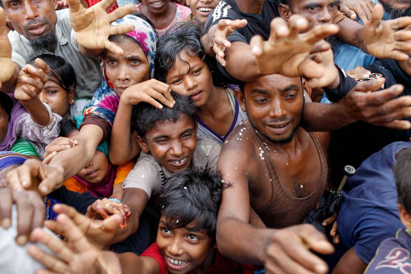Rohingya refugees from Myanmar wait for aid at the Kutupalong refugee camp, the largest in the world, in Bangladesh. AFP