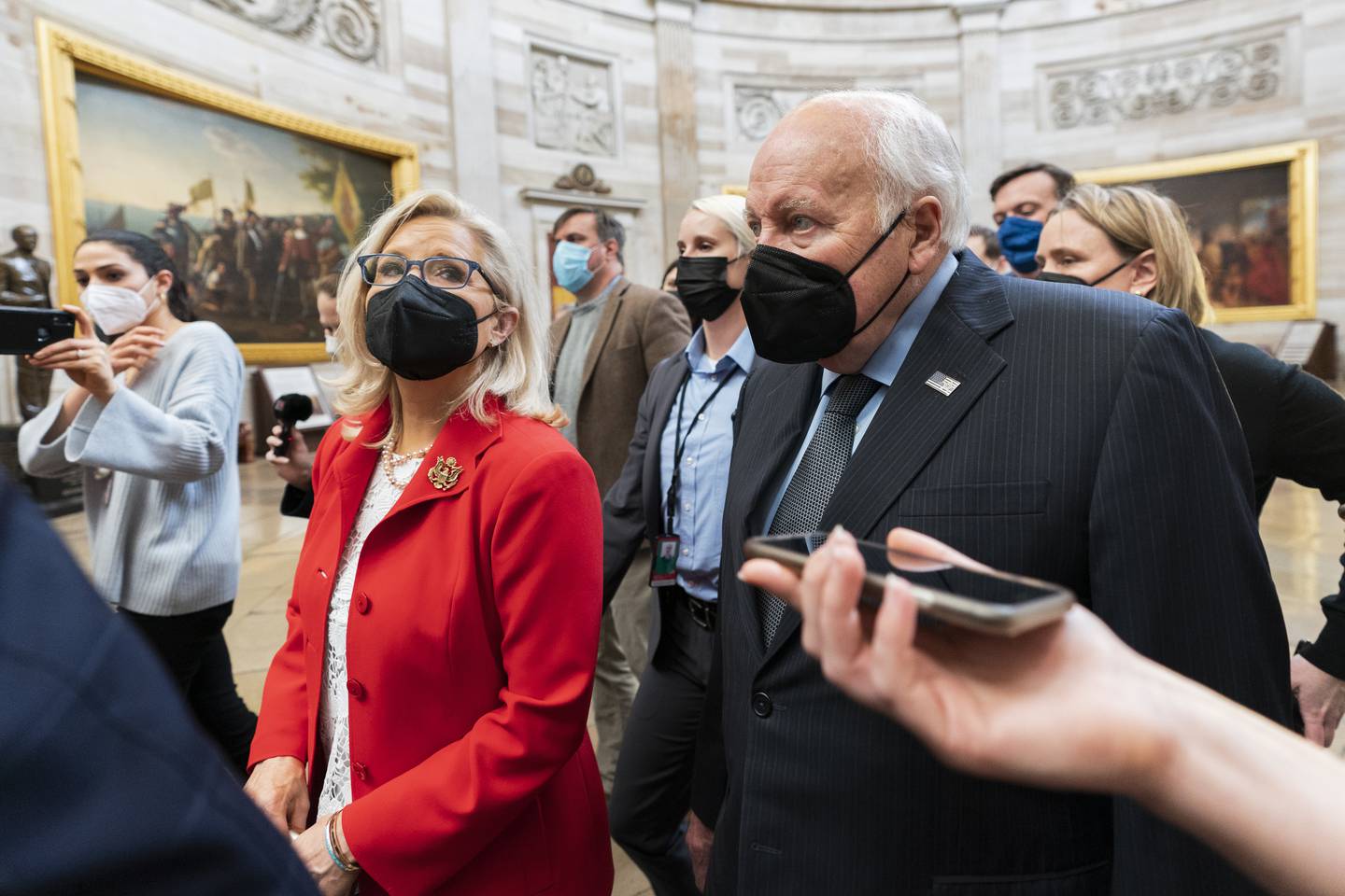 Former US vice president Dick Cheney walks with his daughter Liz Cheney, vice chair of the House panel investigating the January 6 US Capitol attacks, in the Capitol Rotunda in Washington last week. AP Photo
